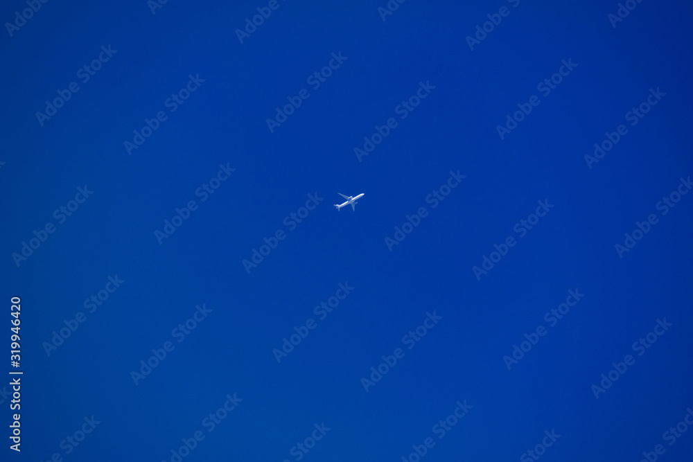 Plane in the deep blue sky