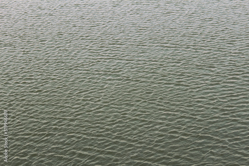 Water surface background from above. Water background.