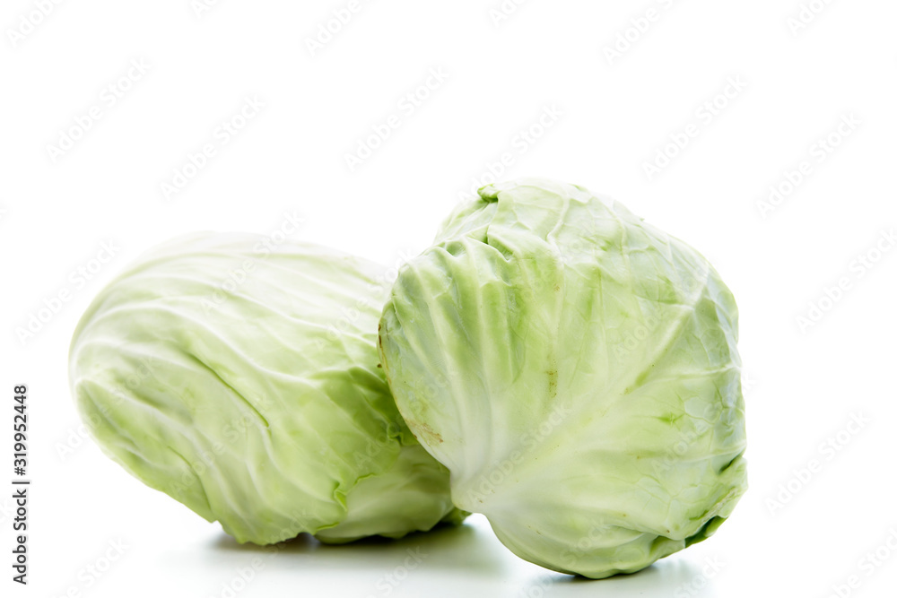 Obraz premium Fresh green cabbage on white background.