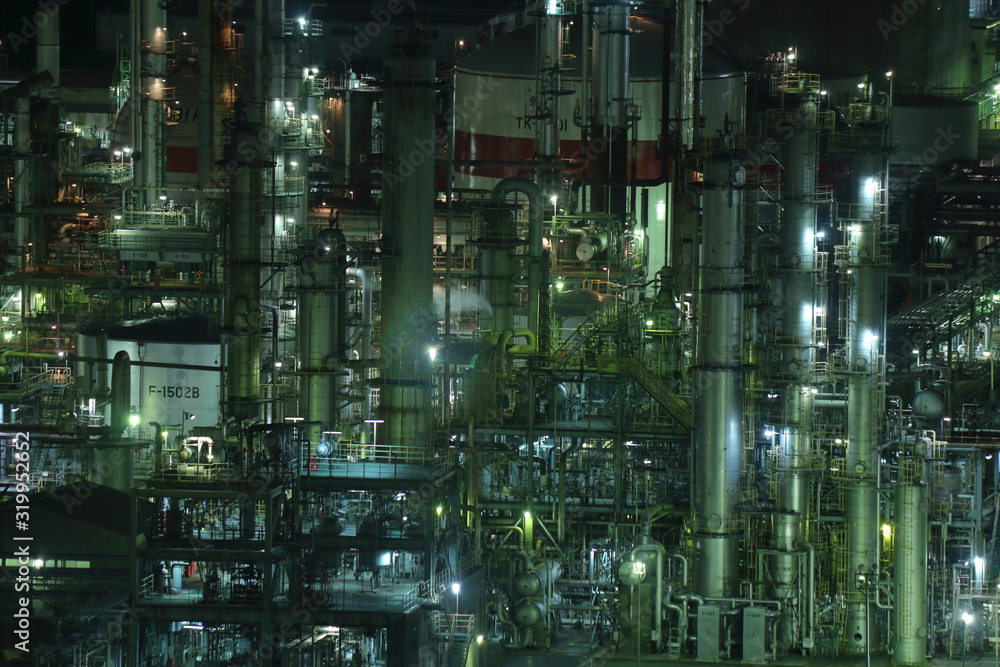Fantastic night view of the factory with green light in Yokkaichi, Japan.