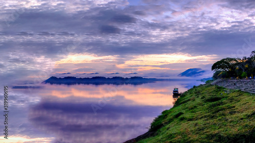 Sunrise over MaeKhong river in Thailand, panoramic scenery, banner design © AUNTYANN