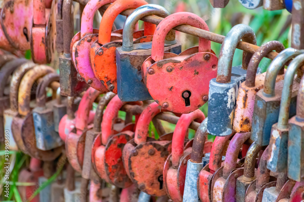 Group of old rusty locks closed during theier marriages as a symbol of eternal love and matrimonial promises. Group of old rusty locks closed during theier marriages as a symbol of eternal love and matrimonial promises.