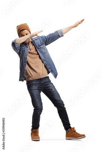 Young guy in casual clothes making a dab pose photo