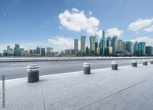 Photography cityscape and skyline of shanghai from empty asphalt road.