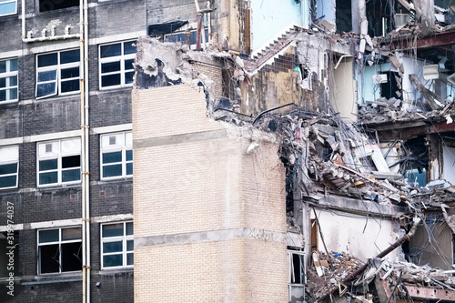 Demolition of office building collapse following explosion by construction industry