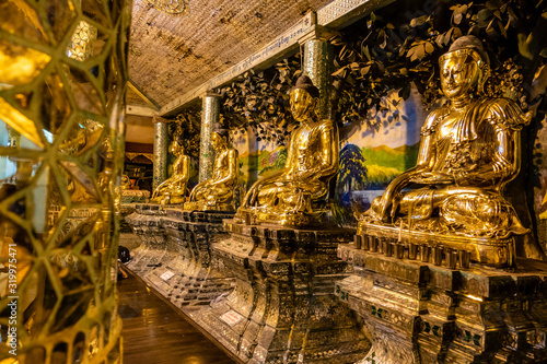 Golden Buddhas at Shwedagon pagoda in Yangon