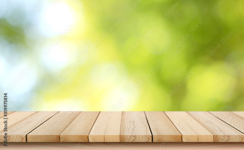 blurred background of green park in summer, Wood table top on shiny bokeh green background. For product display - obrazy, fototapety, plakaty 