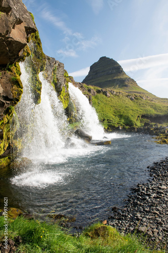 One of the most popular waterfall on Iceland - Kirkjufellsfoss on snaefellsnes peninsula  Iceland in summer.