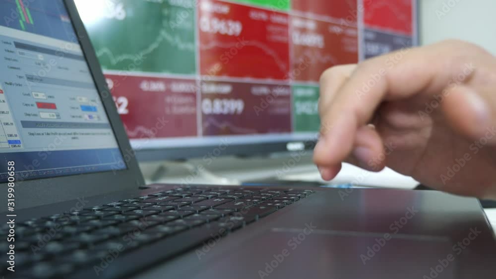 trader use computer working with forex and cryptocurrency , data and bar chart. trader use computer working with forex and cryptocurrency , data and bar chart.