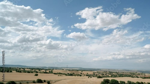 Scenic landscape of spanish mountains and fields. View from the window of high speed train riding through suburb of Spain. 4K photo