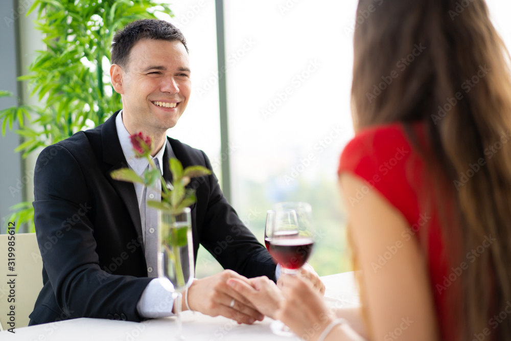 husband and wife having a lunch at restaurant in valentine's day husband and wife having a lunch at restaurant in valentine's day