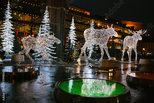 Stockholmsjul.Julbelysning, älgar och granar vid Sergels torg i Stockholm