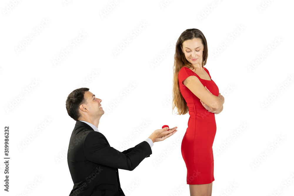 Isolated with clipping path. Man asking his girlfriend to marriage. Isolated with clipping path. Man asking his girlfriend to marriage.