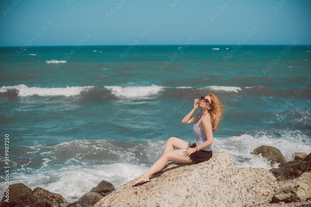 Spring - Summer season. Vacation and travelling time. Woman at sea, pretty nice view Spring - Summer season. Vacation and travelling time. Woman at sea, pretty nice view