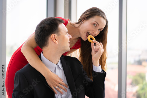 Romantic caucasian couple havin a lunch together at the sky bar restaurant. photo