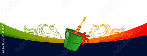 bucket filled with colors and pichkari for holi festival