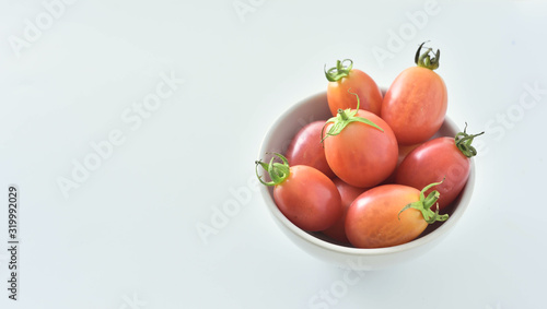 Fresh tomatoes on white background