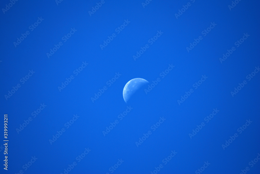 Nature scene of Crescent moon in day time with Clearly Blue sky texture background with copy space Nature scene of Crescent moon in day time with Clearly Blue sky texture background with copy space