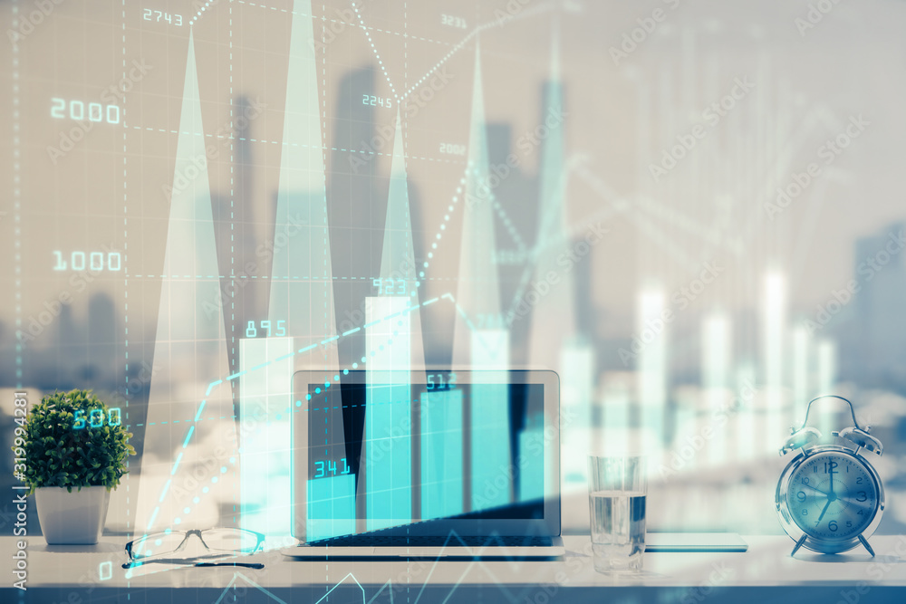 Forex graph hologram on table with computer background. Multi exposure. Concept of financial markets. Forex graph hologram on table with computer background. Multi exposure. Concept of financial markets.
