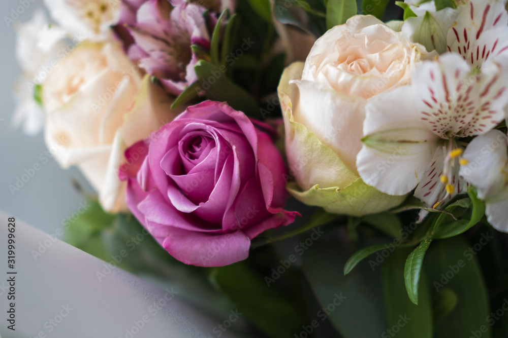 Alstroemeria and roses in a bouquet. Flower arrangement close-up. Alstroemeria and roses in a bouquet. Flower arrangement close-up.