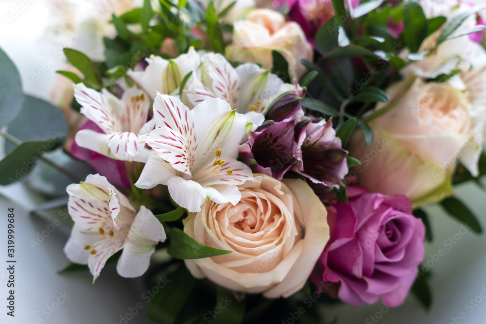 Alstroemeria and roses in a bouquet. Flower composition. Alstroemeria and roses in a bouquet. Flower composition.