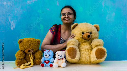 Beautiful woman with teddy bears photo