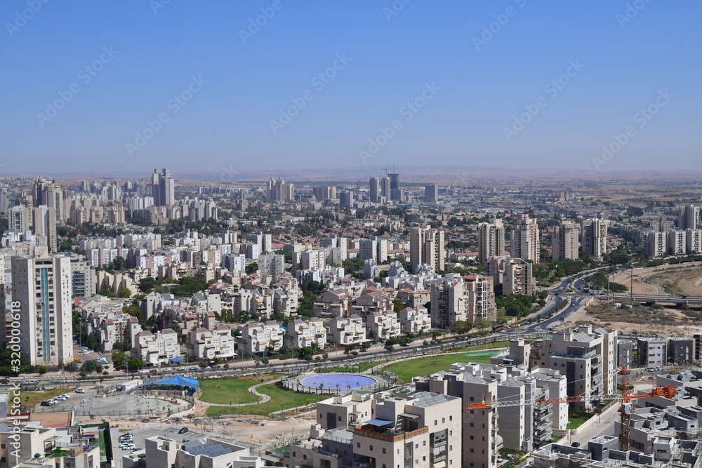 TOP VIEW OF CITY WITH BUILDINGS LAKE AND GREEN FIELDS BEER SHEVA ISRAEL