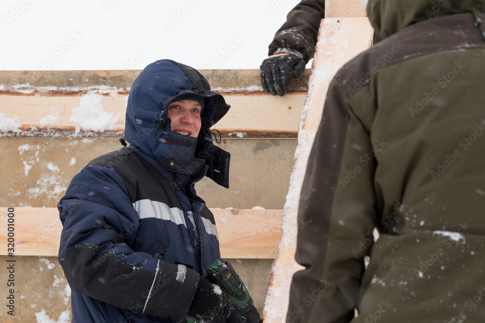 Portrait of a worker in overalls at a construction site Portrait of a worker in overalls at a construction site