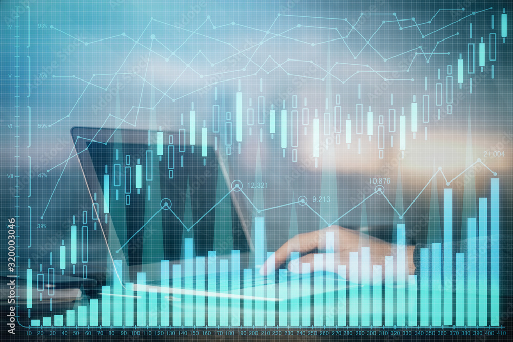 Double exposure of stock market graph with man working on laptop on background. Concept of financial analysis. Double exposure of stock market graph with man working on laptop on background. Concept of financial analysis.