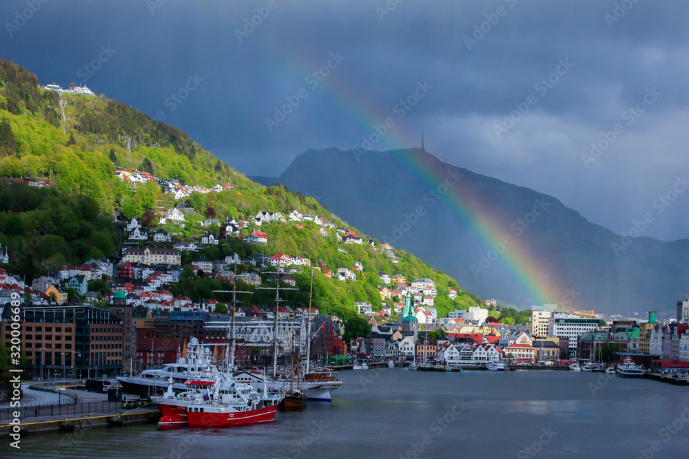 BERGEN NORWAY - 2015 JUNE 01.  Bergen city with dark clouds and rainbow.