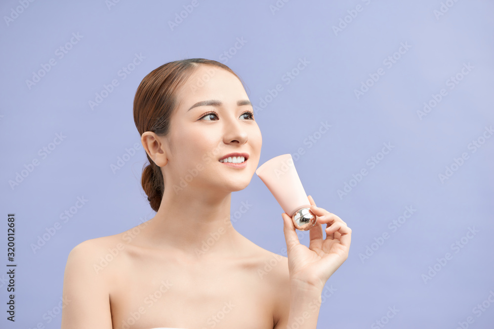 asian woman showing cream on her hand, isolated on white asian woman showing cream on her hand, isolated on white