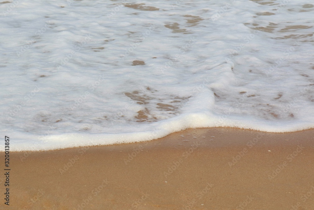 Soft focus of the waves beat at the beach with shell fragments with sunlight in summer time. Nature background concept. Soft focus of the waves beat at the beach with shell fragments with sunlight in summer time. Nature background concept.