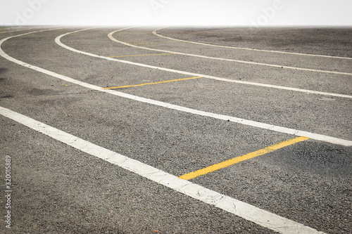 black tarmac asphalt of running track  athletic sport background