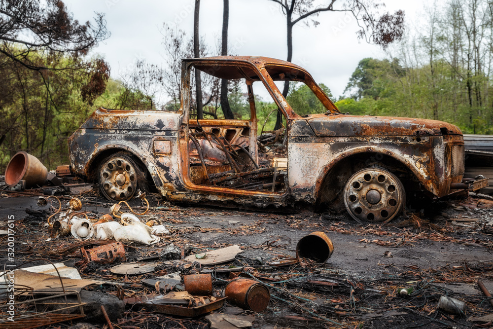 Australian bushfire aftermath: Burnt car carcass and rubble at Bilpin in Blue Mountains, Australia. Australian bushfire aftermath: Burnt car carcass and rubble at Bilpin in Blue Mountains, Australia.