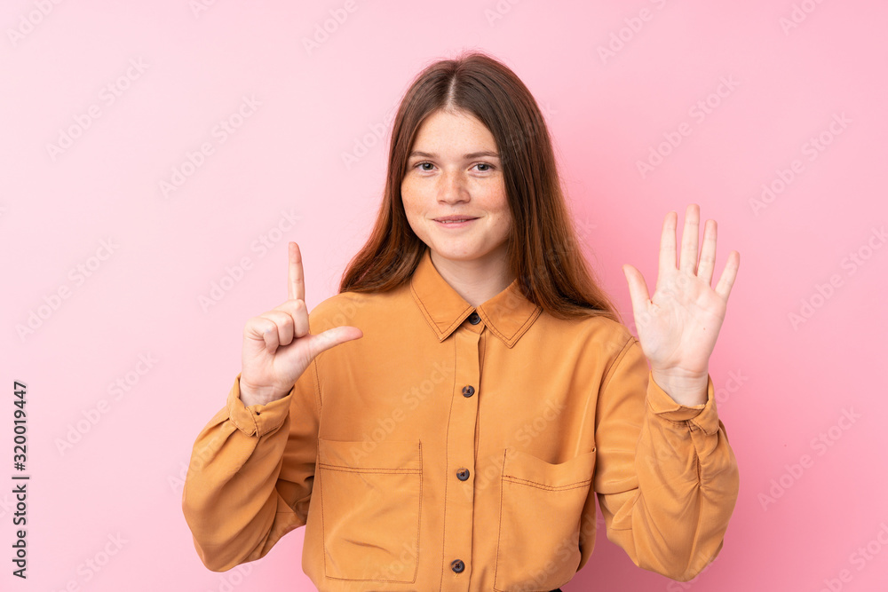 Ukrainian teenager girl over isolated pink background counting seven with fingers Ukrainian teenager girl over isolated pink background counting seven with fingers