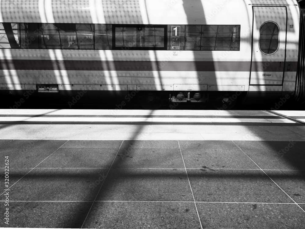 Sunlight Falling On Train At Railroad Station Platform