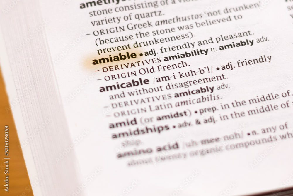 Ivanovsk, Russia - November 19, 2018: The word or phrase Amiable in a dictionary. Ivanovsk, Russia - November 19, 2018: The word or phrase Amiable in a dictionary.