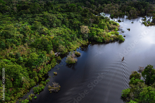 Aerial view of a small boat over the river