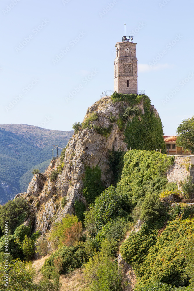 View of picturesque Arachova mountainous village with iconic tower clock in Greece, at the foot of Mount Parnassos, near Delphi.