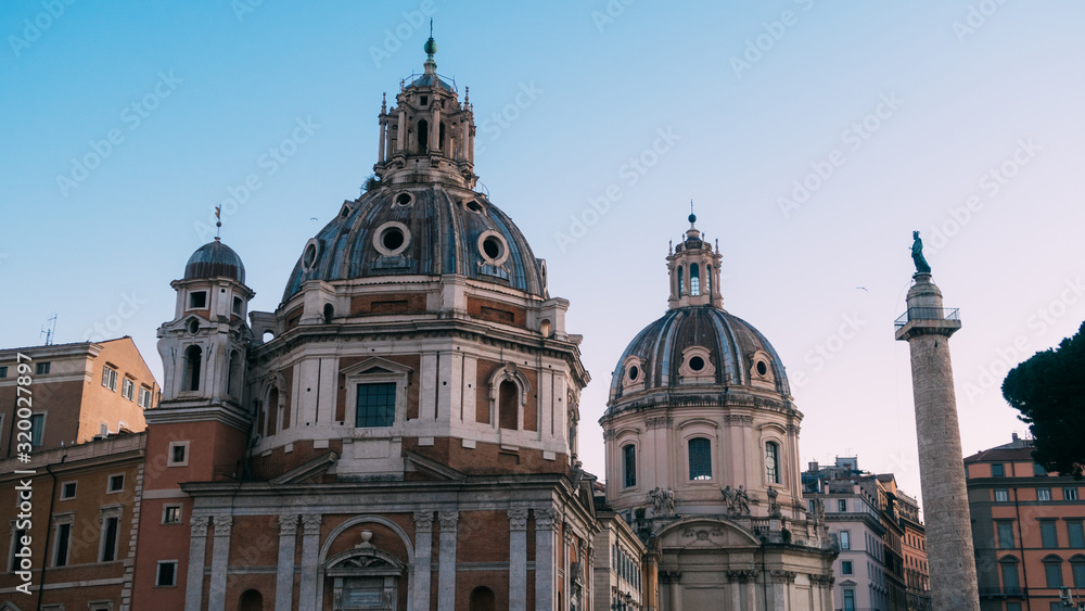 Rome, Italy - Jan 2, 2020: Trajan's column and Santa Maria di Loreto, Rome, Italy