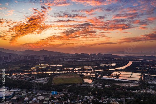 Aerial View of rural green fields in Hong Kong border and skylines in Shenzhen,China