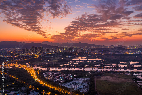 Aerial View of rural green fields in Hong Kong border and skylines in Shenzhen,China