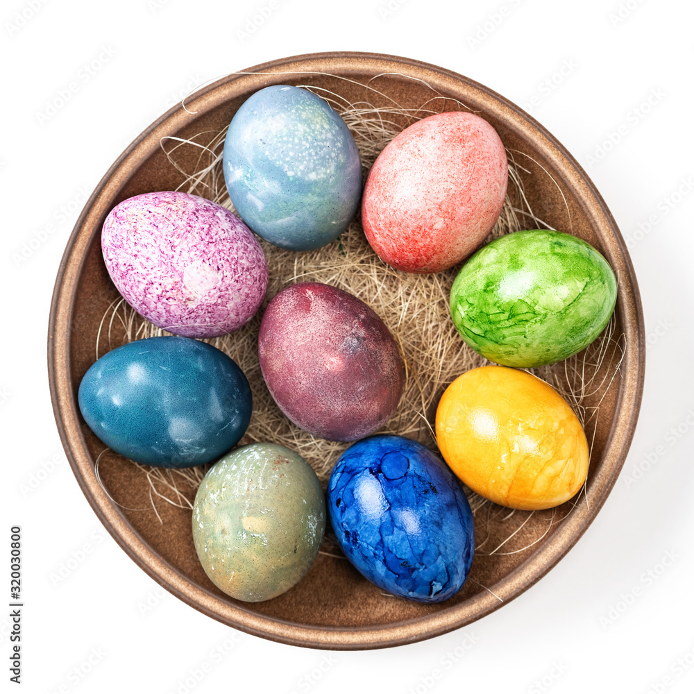Different easter eggs in ceramic bowl isolated on white Different easter eggs in ceramic bowl isolated on white