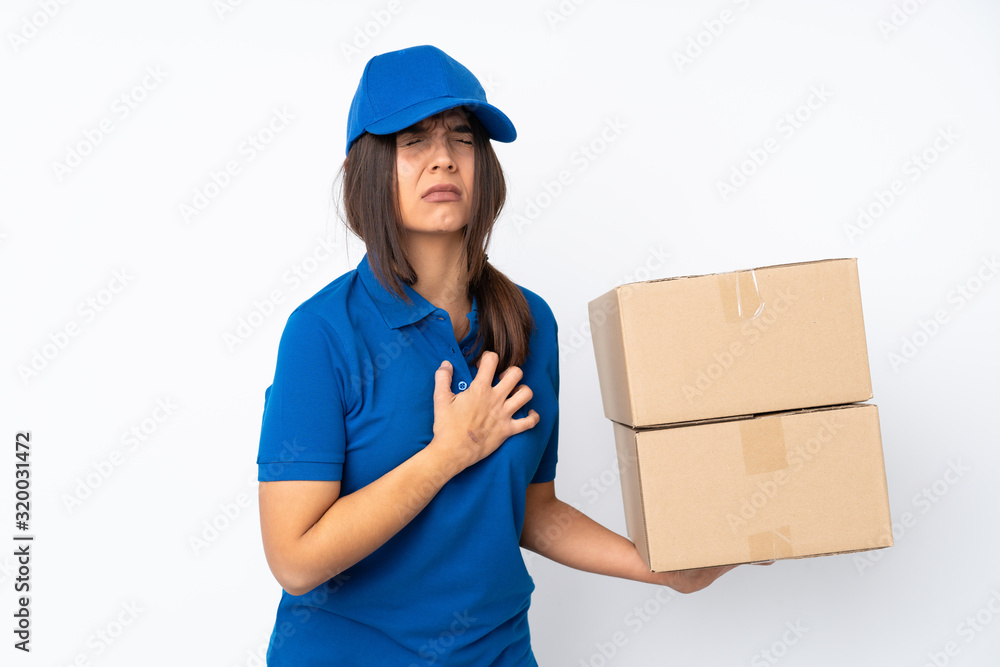 Young delivery brunette girl over isolated white background having a pain in the heart Young delivery brunette girl over isolated white background having a pain in the heart