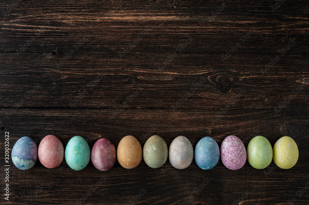Different easter eggs on wooden background Different easter eggs on wooden background