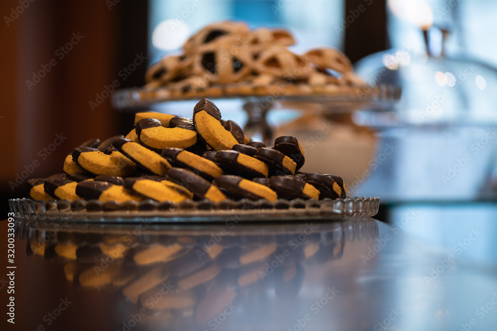 Biscuits with chocolate, on a wooden bar counter in Italy Biscuits with chocolate, on a wooden bar counter in Italy