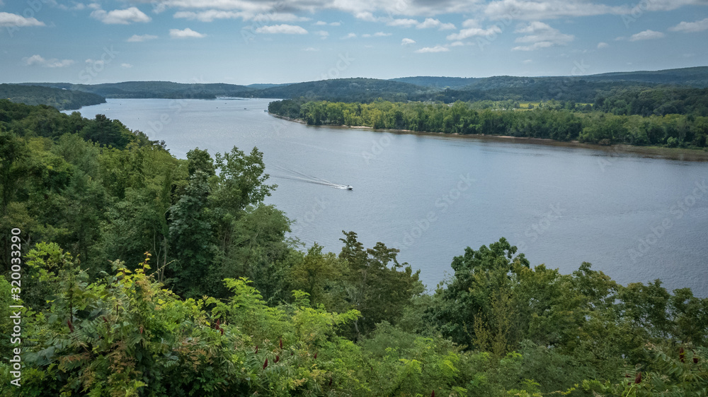 Power boat traveling the Connecticut River Power boat traveling the Connecticut River