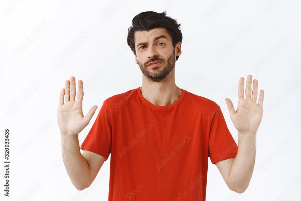 No thanks, I refuse. Arrogant good-looking bearded man in red t-shirt, raise arms in prohibition, forbid gesture, smirk and shake head displeased, rejecting bad offer, white background No thanks, I refuse. Arrogant good-looking bearded man in red t-shirt, raise arms in prohibition, forbid gesture, smirk and shake head displeased, rejecting bad offer, white background