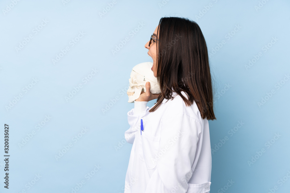 Police forensic specialist girl over isolated background laughing in lateral position Police forensic specialist girl over isolated background laughing in lateral position