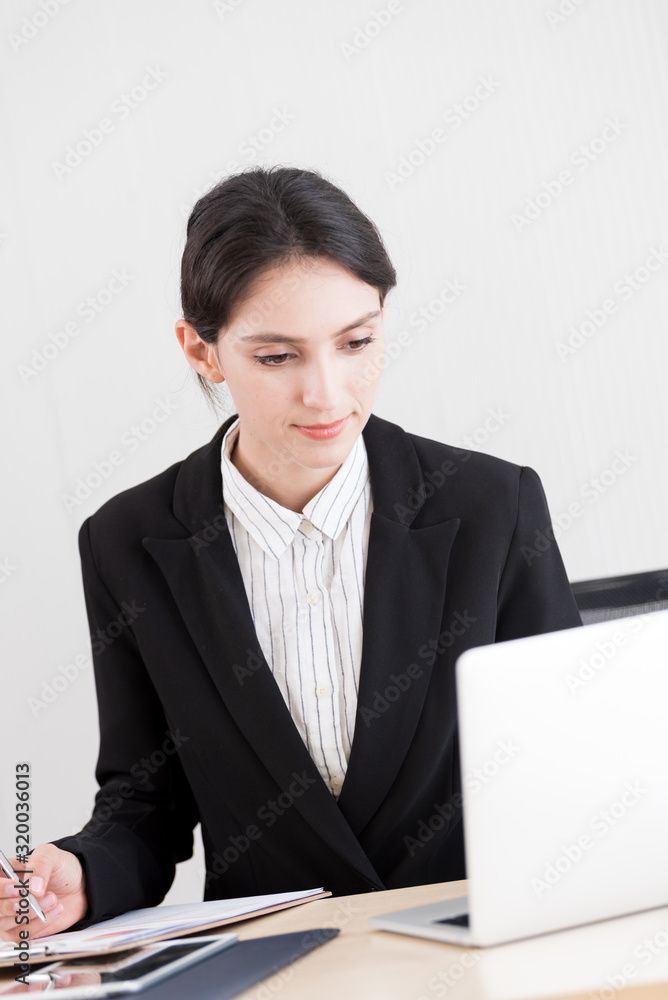 A businesswoman has working with concentrate and happiness. A businesswoman has working with concentrate and happiness.